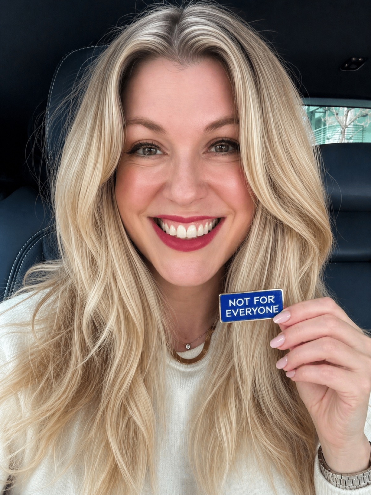 Kimberly holding a Not for Everyone pin