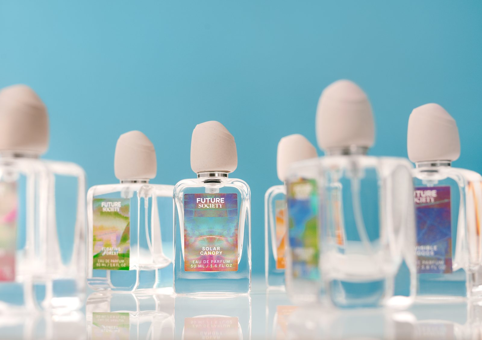 The Scent Surrection Collection lineup on blue