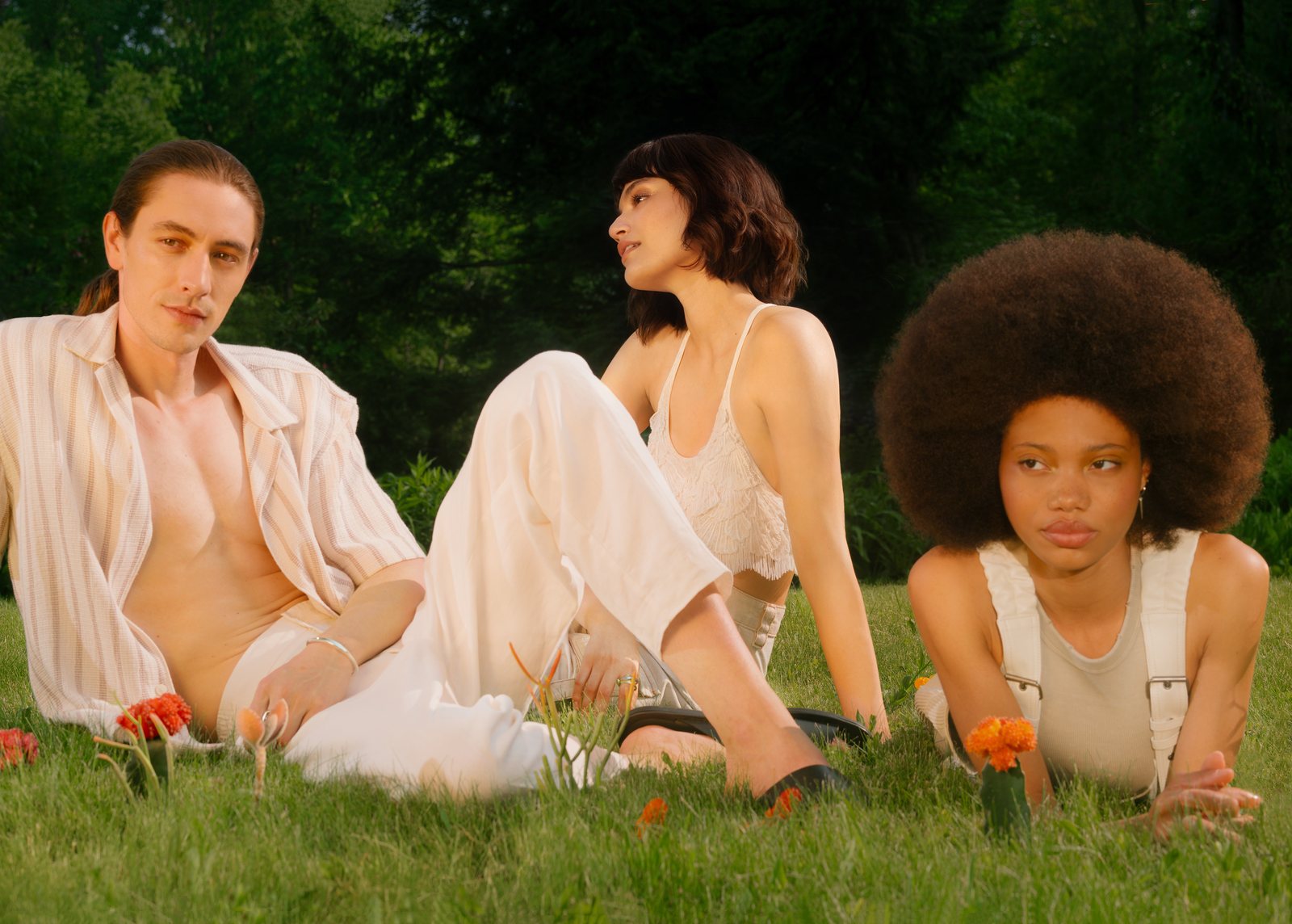 Future Society campaign — three models in the grass among wildflowers
